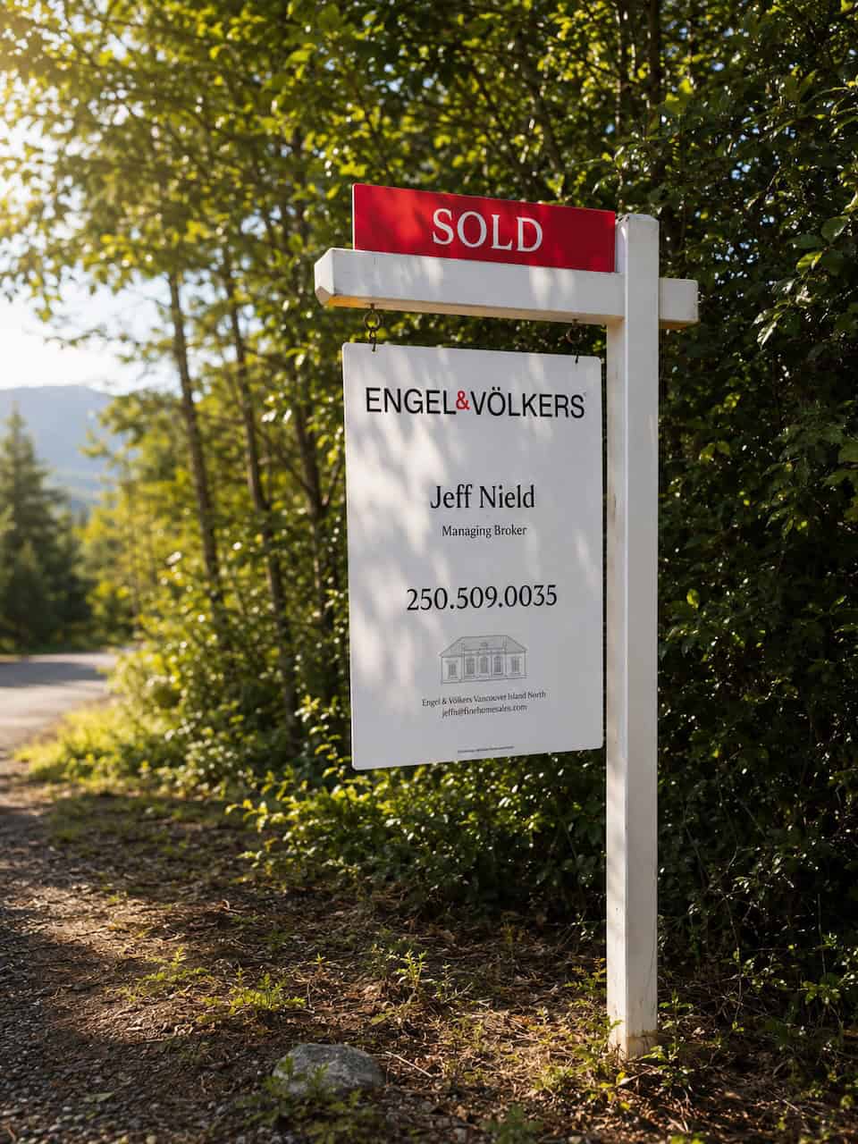 Real estate for sale sign in front of a Comox Valley home, illustrating the July 2026 market snapshot